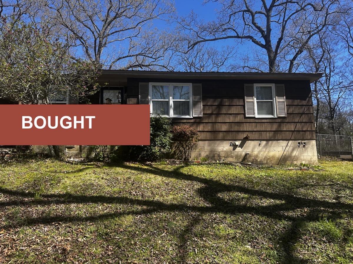 A brown single-family home previously purchased by Shades Creek Home Buyers.